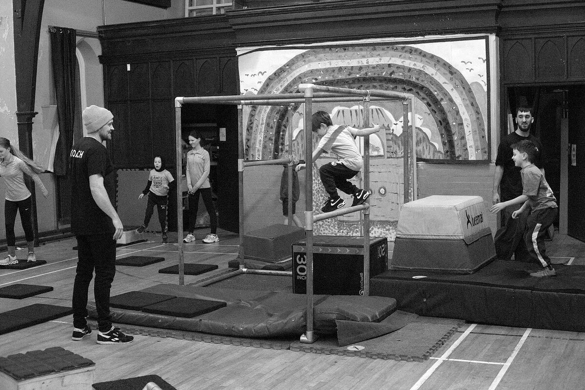 Students working together during a Parkour movement session