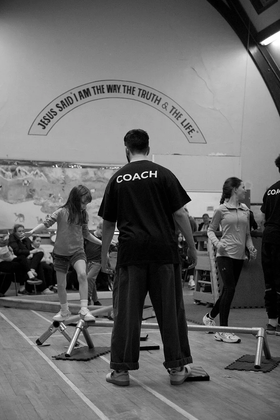 Movement Matters coach overseeing young people navigating equipment at Hope Church