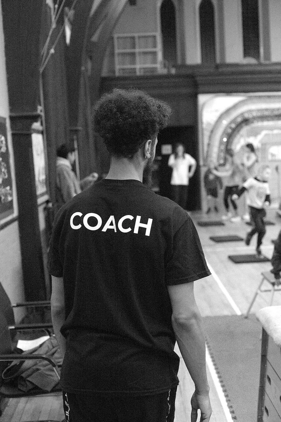 Movement coaching session demonstrating technique and progression