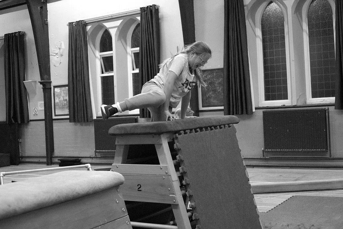 Young person vaulting over equipment during a Movement Matters Parkour session